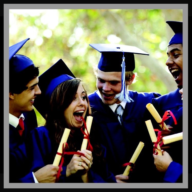 Graduates in blue gowns, holding diplomas tied with red ribbon.